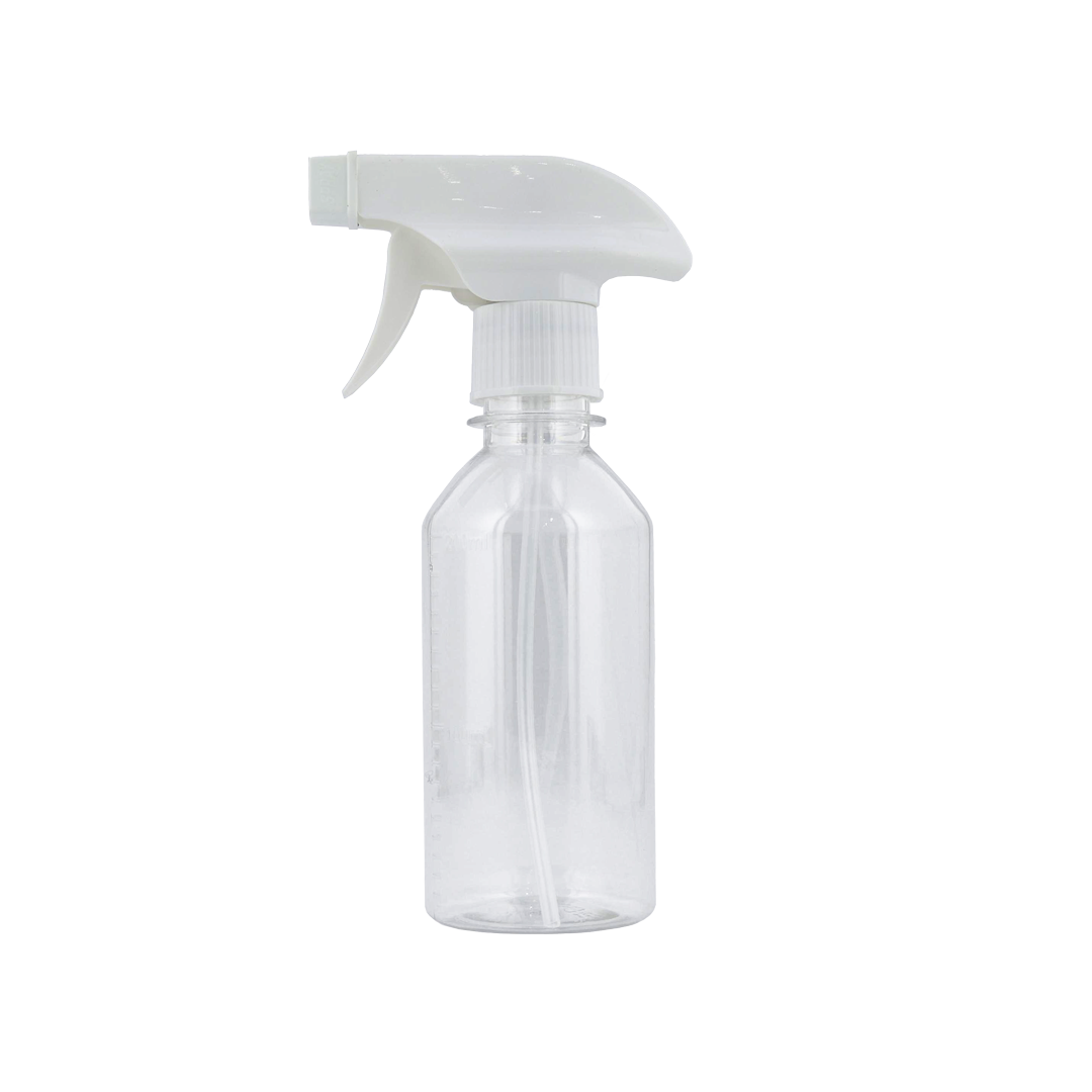 Clear spray bottle with white nozzle on a white background