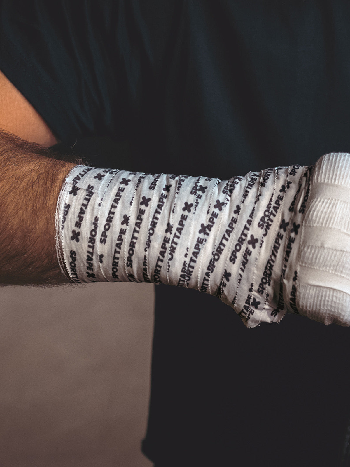 Athlete with Boxing hand wrap of Gauze and Zinc Oxide Branded 2.5cm.