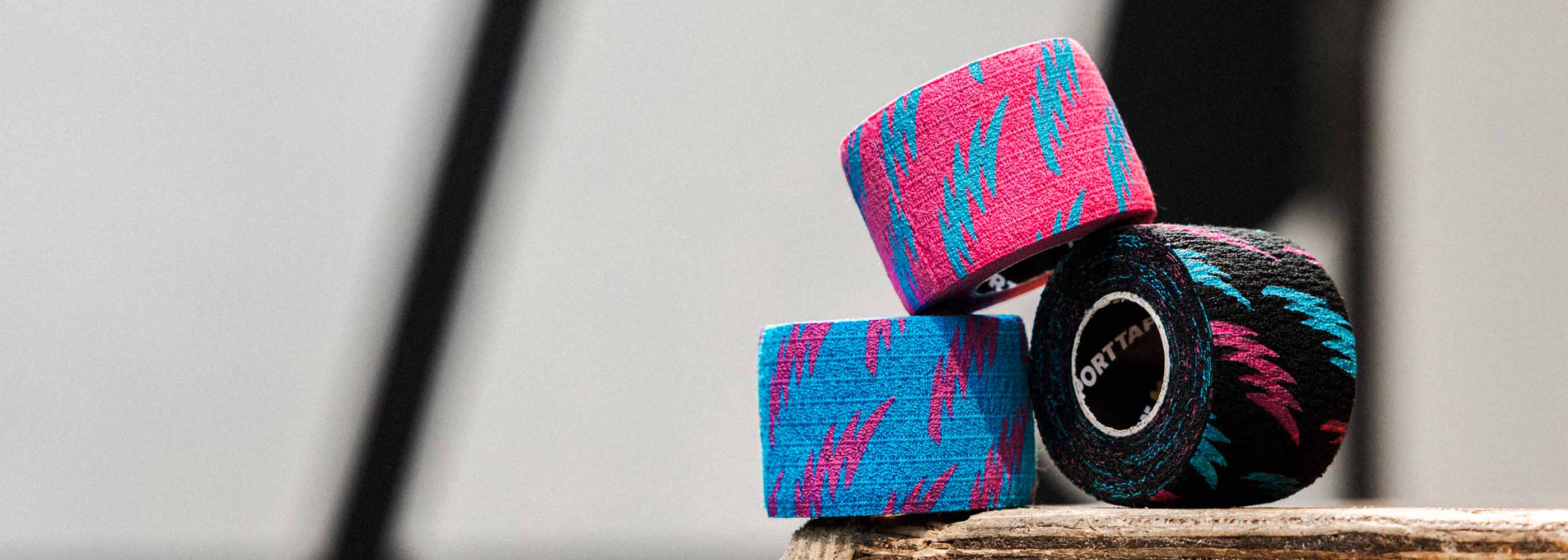 A roll of Pink, Blue and Black Punk Thumb Tape