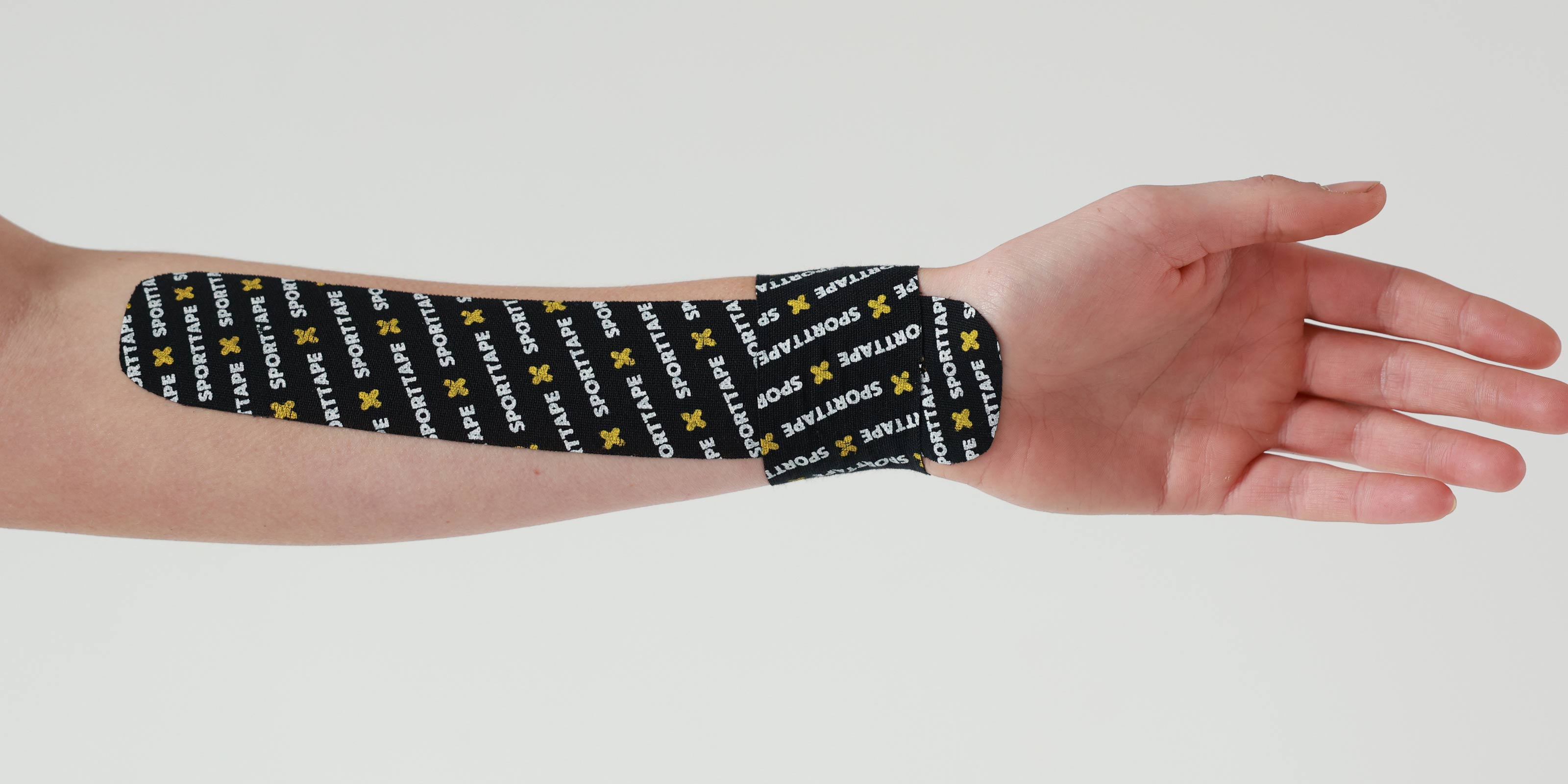 Kinesiology Tape on wrist and forearm