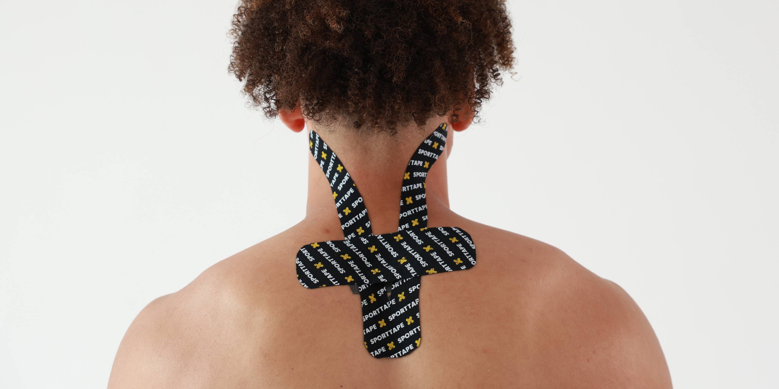Person wearing SPORTTAPE branded kinesiology tape on the neck on a plain background