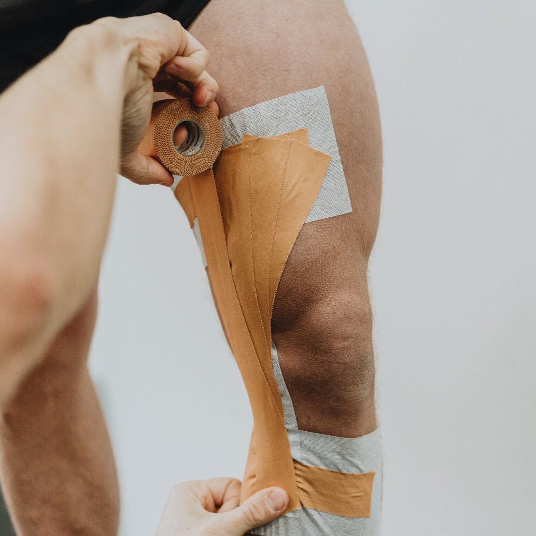 Zinc Oxide Tan Tape applied to the Knee