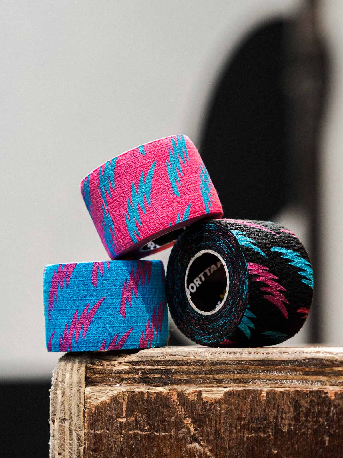 A roll of Pink, Blue and Black Punk Thumb Tape