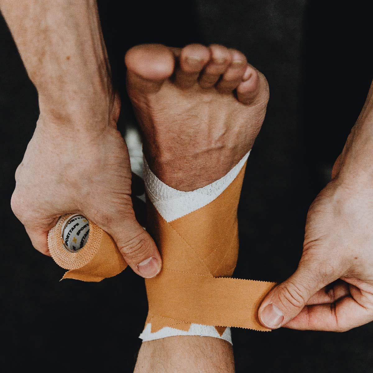 strapping the ankle using Zinc Oxide Tape