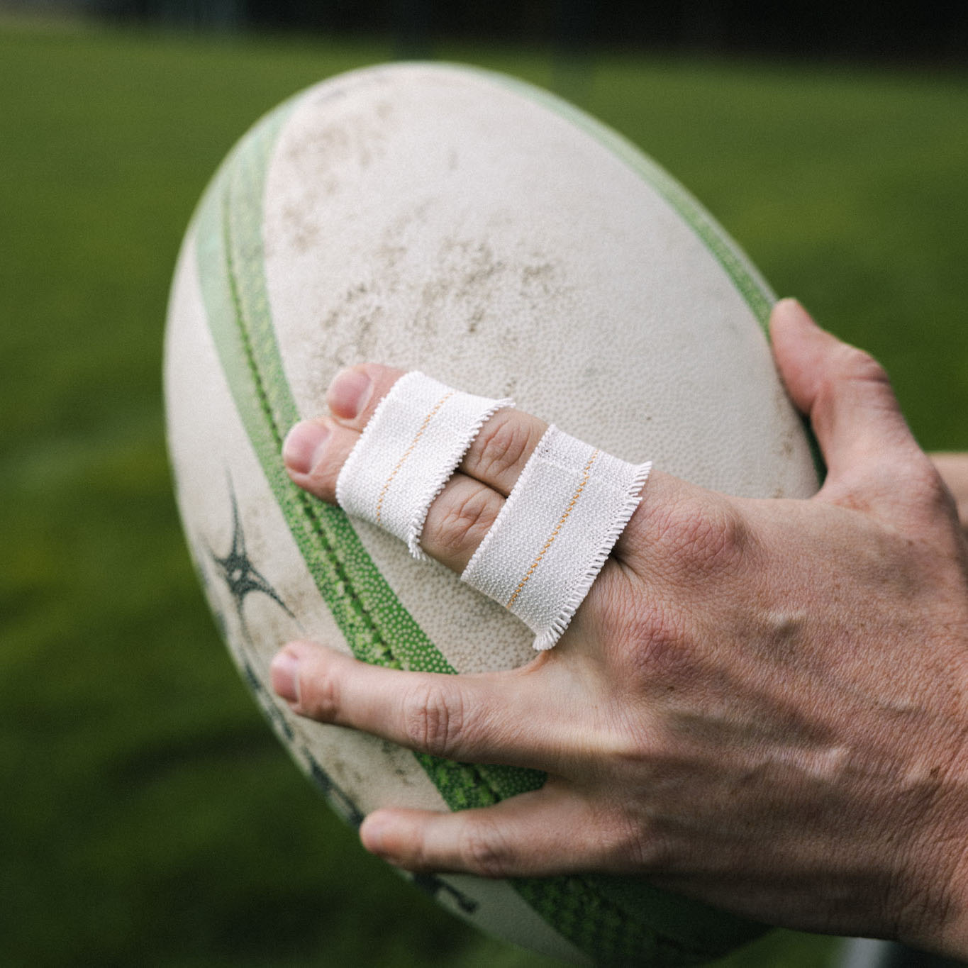 Non tear eab on fingers with rugby ball